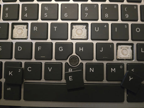 Replacement laptop keycap with its hinge clip
